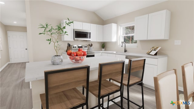 kitchen featuring white cabinetry, lofted ceiling, and white electric range