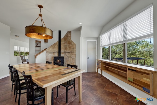 tiled dining area with a wood stove