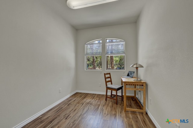 office area with wood-type flooring