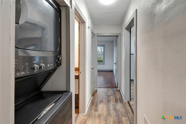 2901 Lone Tree Rd, Victoria, TX 77901 - laundry room with stacked washer / dryer and wood finished floors
