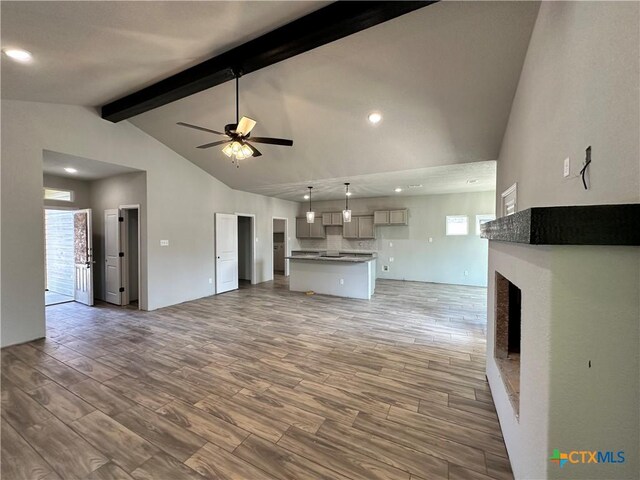 2591 Cedar Glen Dr, Belton, TX 76513 - unfurnished living room featuring ceiling fan, wood finished floors, a fireplace, plenty of natural light, and recessed lighting