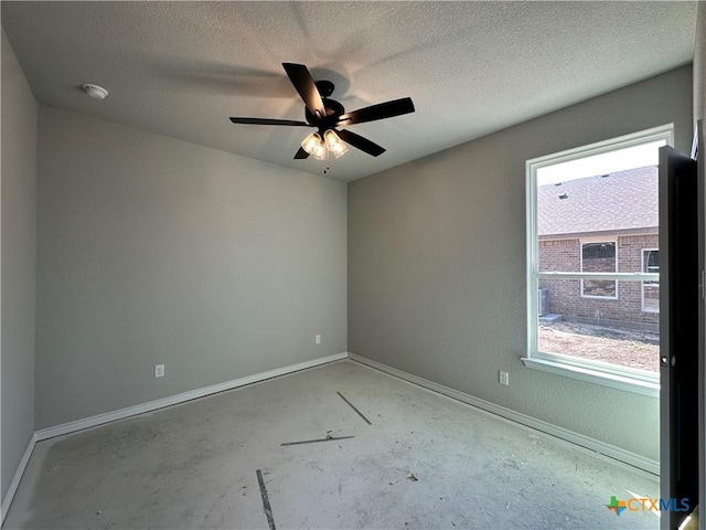 2591 Cedar Glen Dr, Belton, TX 76513 - unfurnished room featuring baseboards, unfinished concrete floors, a textured ceiling, ceiling fan, and a smoke detector