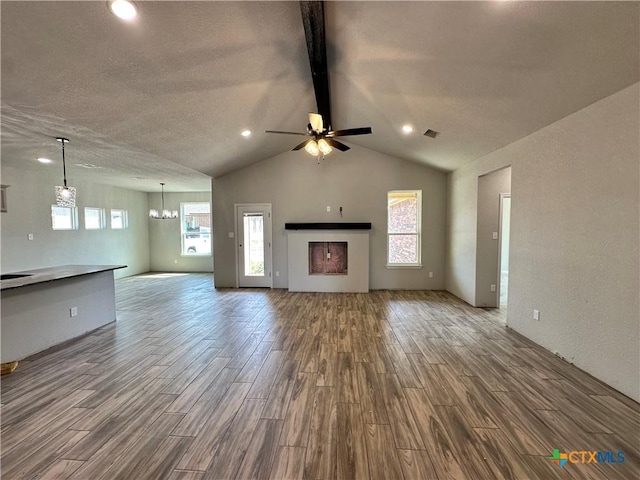2591 Cedar Glen Dr, Belton, TX 76513 - unfurnished living room featuring wood finished floors, a chandelier, a ceiling fan, and recessed lighting