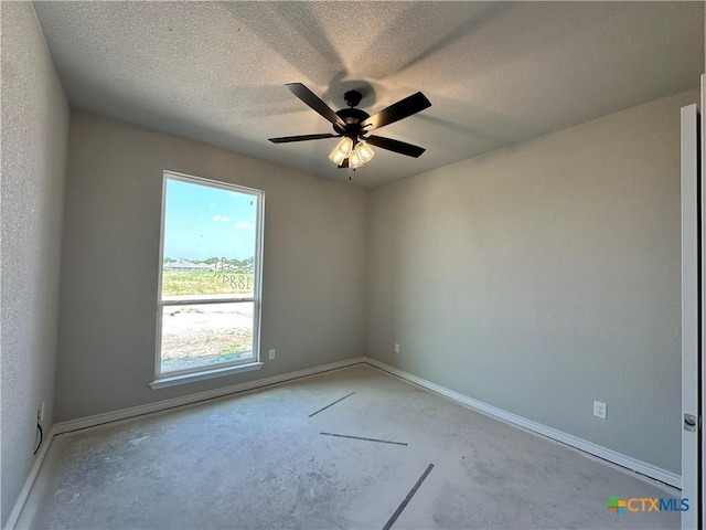 2591 Cedar Glen Dr, Belton, TX 76513 - spare room with concrete floors, ceiling fan, baseboards, and a textured ceiling