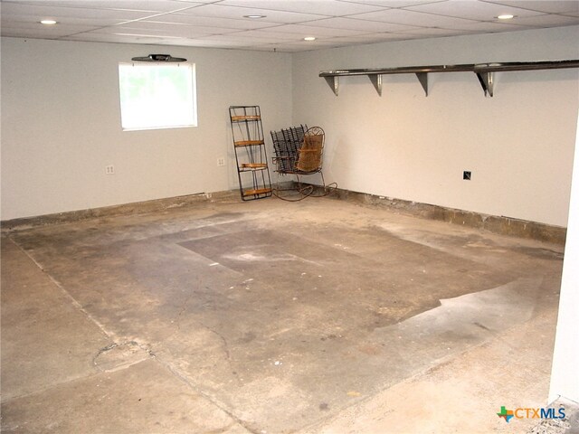 basement featuring a paneled ceiling