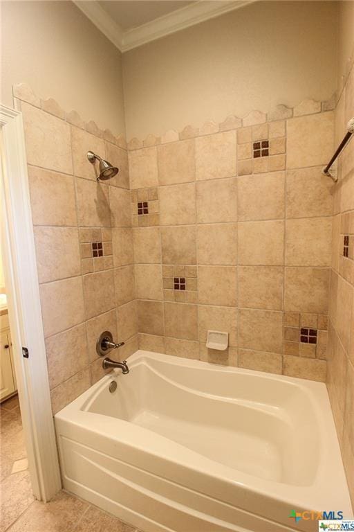 bathroom featuring vanity, tiled shower / bath, and ornamental molding