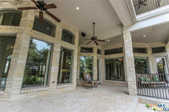 view of patio / terrace featuring ceiling fan