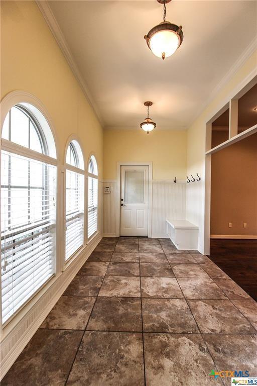 mudroom with crown molding