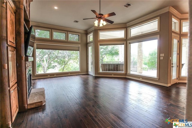 interior space featuring ceiling fan and a fireplace