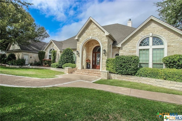 view of front of home with a front lawn