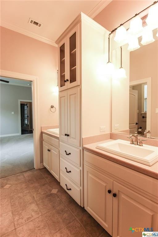 bathroom featuring vanity and crown molding