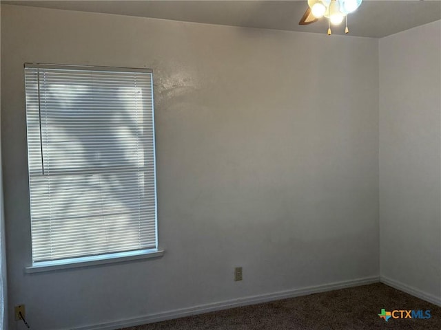 empty room featuring ceiling fan and carpet flooring