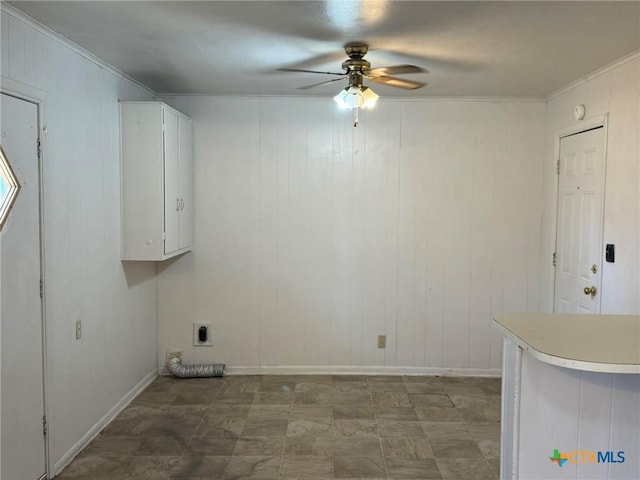 laundry area with ceiling fan, cabinets, ornamental molding, and hookup for an electric dryer