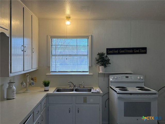 kitchen featuring sink and white electric range