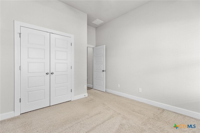 232 Gaida Loop, Georgetown, TX 78628 - unfurnished bedroom with carpet, baseboards, and a closet