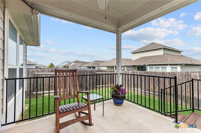 232 Gaida Loop, Georgetown, TX 78628 - balcony featuring ceiling fan, a patio, and a residential view