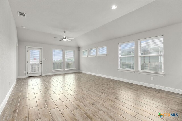 232 Gaida Loop, Georgetown, TX 78628 - spare room featuring a ceiling fan, vaulted ceiling, light wood-type flooring, and baseboards