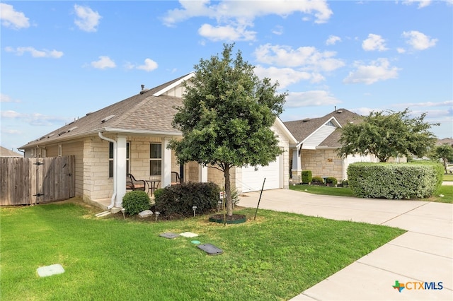 232 Gaida Loop, Georgetown, TX 78628 - view of front of property with driveway, stone siding, an attached garage, and roof with shingles