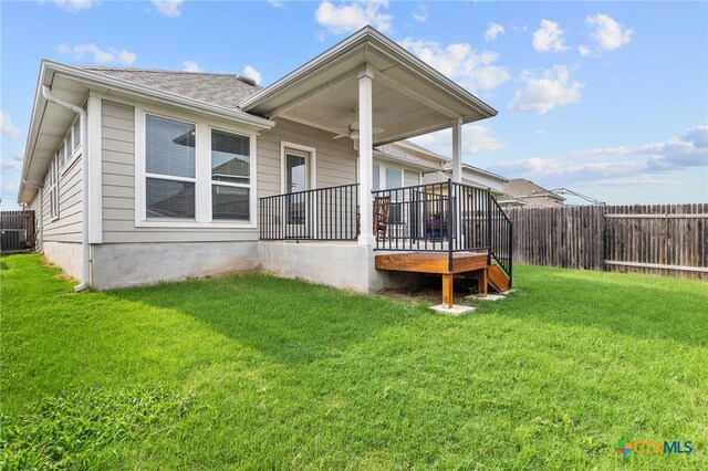 232 Gaida Loop, Georgetown, TX 78628 - rear view of house with a ceiling fan, a shingled roof, and a deck
