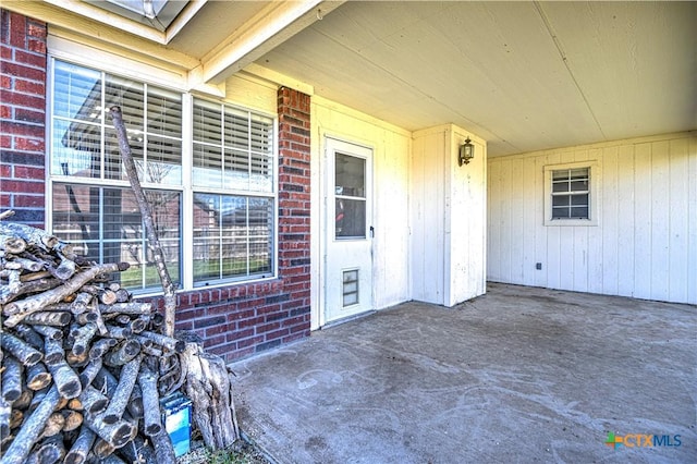 entrance to property with brick siding