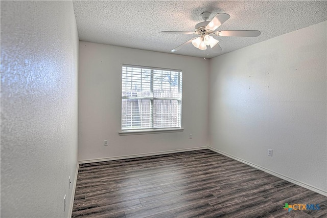 unfurnished room with a ceiling fan, a textured ceiling, wood finished floors, baseboards, and a textured wall