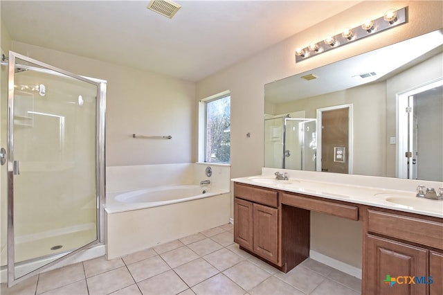 bathroom featuring tile patterned floors, vanity, and plus walk in shower