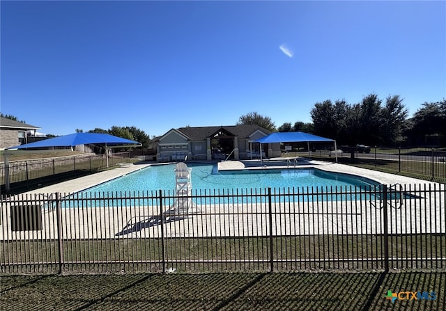 view of swimming pool featuring a patio area