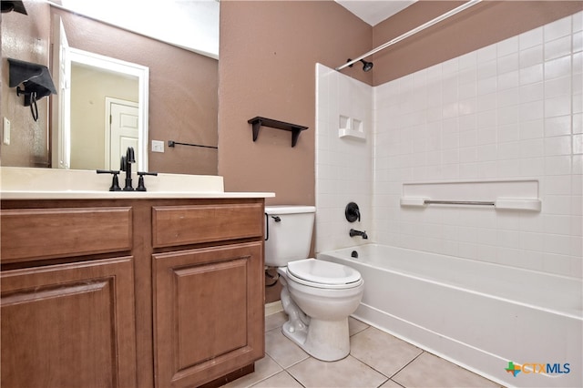 full bathroom with tile patterned flooring, vanity, toilet, and washtub / shower combination