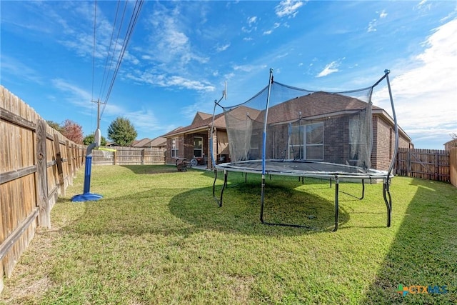 view of yard with a trampoline