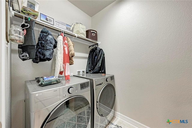 laundry area with washer and clothes dryer