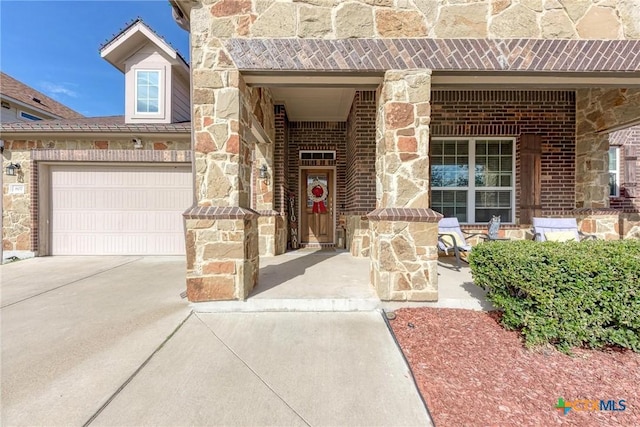 view of exterior entry featuring a garage