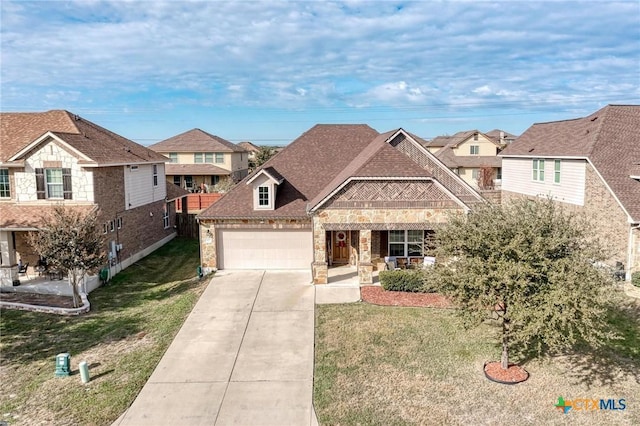 view of front facade with covered porch, a garage, and a front lawn