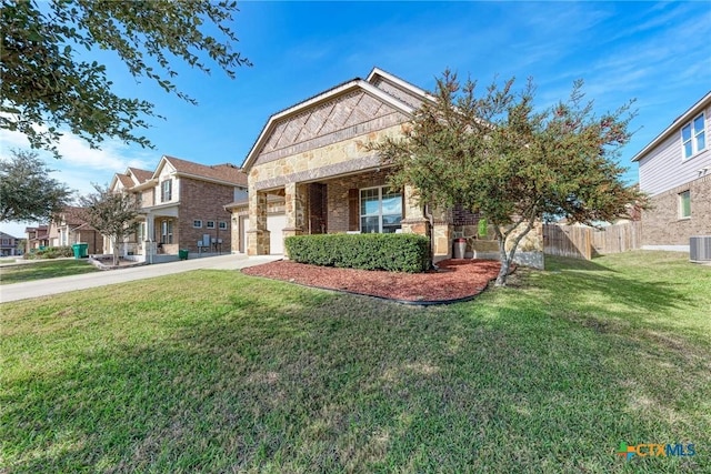 view of front of property featuring a garage, central AC, and a front lawn