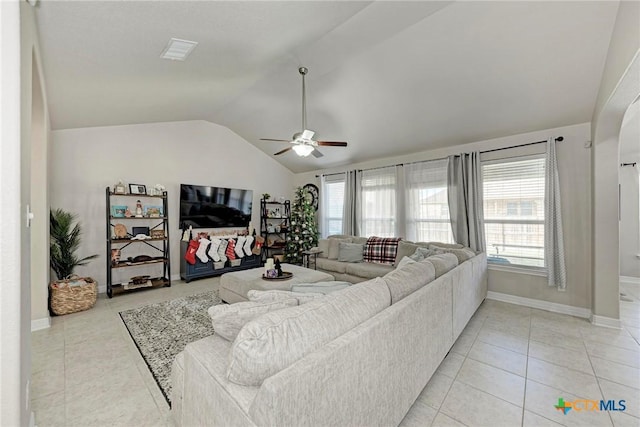 tiled living room with ceiling fan and lofted ceiling