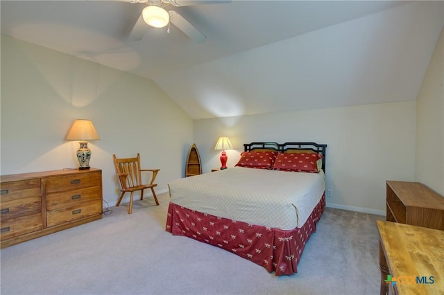 carpeted bedroom featuring a ceiling fan and lofted ceiling