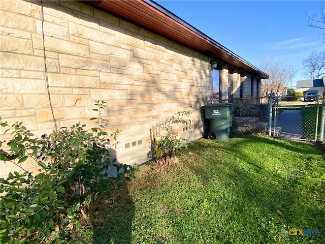 view of property exterior featuring a lawn