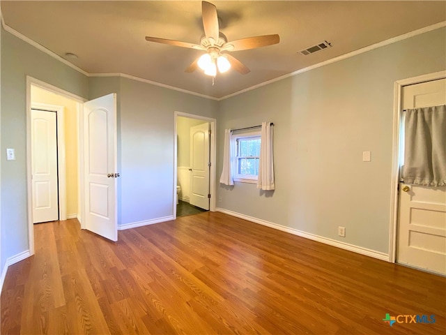 unfurnished bedroom featuring ceiling fan, light hardwood / wood-style flooring, and crown molding