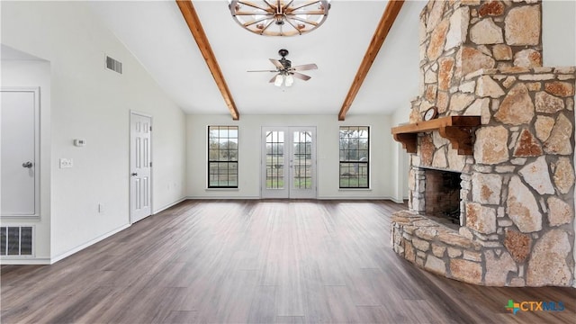 unfurnished living room with hardwood / wood-style floors, vaulted ceiling with beams, ceiling fan, and a fireplace