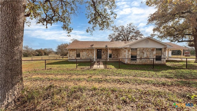 rear view of property with a lawn