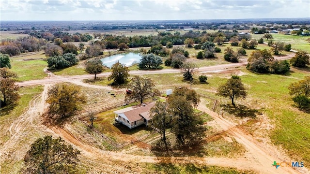 drone / aerial view with a rural view and a water view