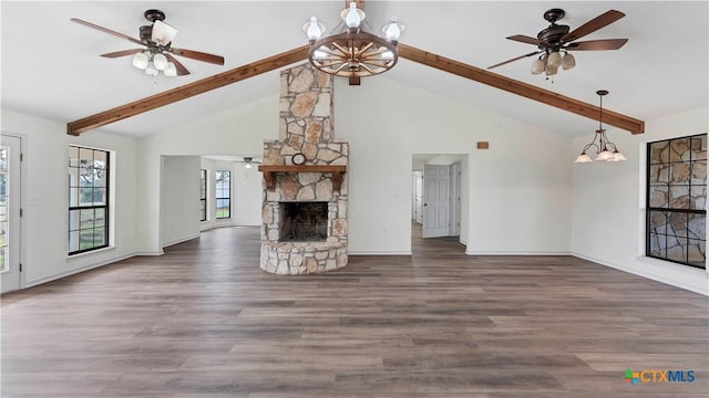 unfurnished living room featuring high vaulted ceiling, ceiling fan with notable chandelier, a fireplace, beamed ceiling, and dark hardwood / wood-style flooring