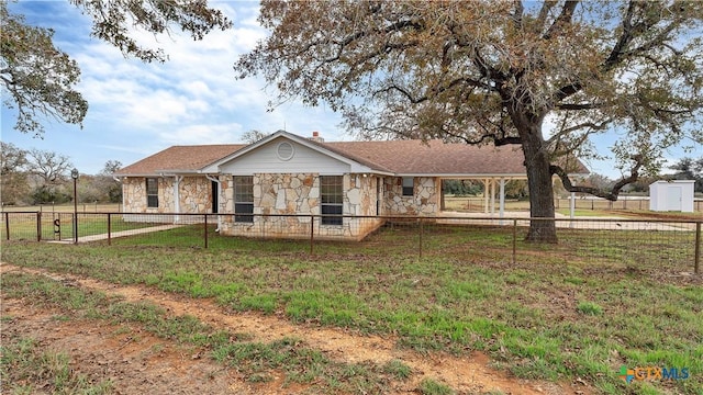 ranch-style home with a front lawn