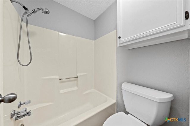 1311 Speight Ave, Waco, TX 76706 - bathroom with  shower combination, toilet, and a textured ceiling