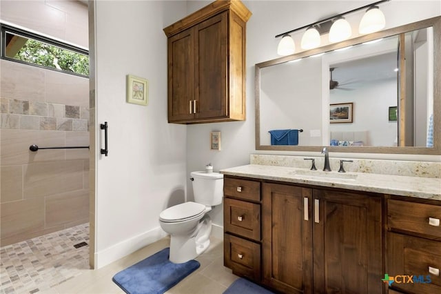 1204 Salt Lick Dr, New Braunfels, TX 78132 - full bath with vanity, tiled shower, a ceiling fan, and tile patterned flooring