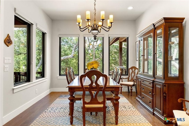 1204 Salt Lick Dr, New Braunfels, TX 78132 - dining area featuring a chandelier, dark wood-style floors, and recessed lighting