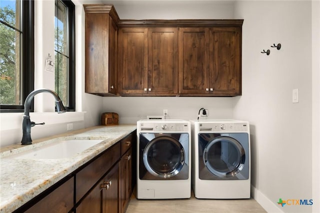 1204 Salt Lick Dr, New Braunfels, TX 78132 - laundry room with cabinet space and independent washer and dryer