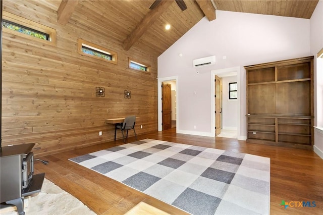 1204 Salt Lick Dr, New Braunfels, TX 78132 - living area featuring high vaulted ceiling, wooden walls, wood finished floors, a wood ceiling with exposed beams, and a wall mounted air conditioner