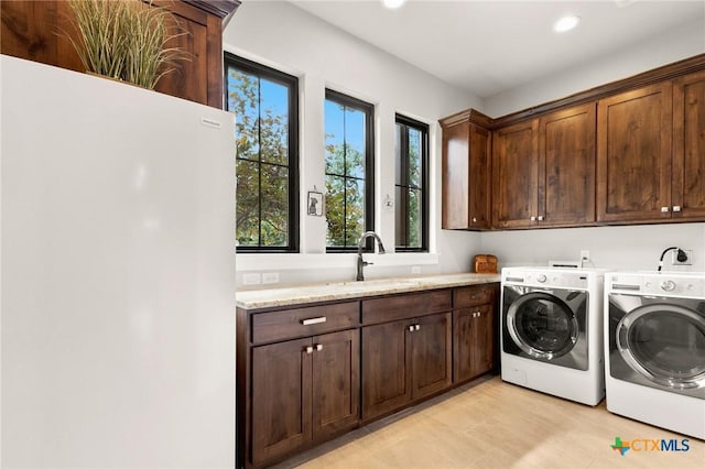 1204 Salt Lick Dr, New Braunfels, TX 78132 - laundry area with washer and clothes dryer, cabinet space, and recessed lighting