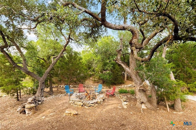 1204 Salt Lick Dr, New Braunfels, TX 78132 - view of yard with an outdoor fire pit