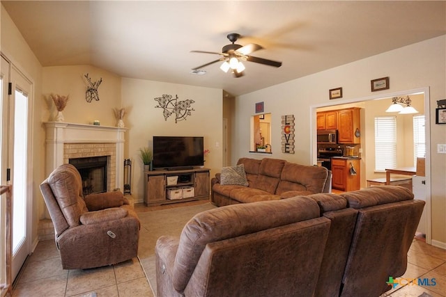 6 S Bobcat Ct, Belton, TX 76513 - living area with light tile patterned floors, a ceiling fan, and a brick fireplace